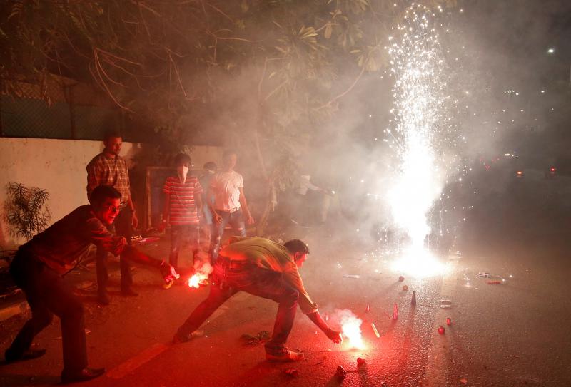 The fireworks of Diwali, the Hindu festival of lights, add smoke to the already polluted skies — and raise concerns about the impact of all that pollution on coronavirus cases. Here, a celebration takes place last year in Ahmedabad, India. The fireworks of Diwali, the Hindu festival of lights, add smoke to the already polluted skies — and raise concerns about the impact of all that pollution on coronavirus cases. Here, a celebration takes place last year in Ahmedabad, India.