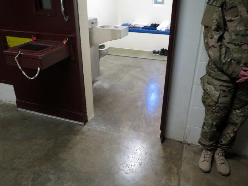 A U.S. military service member stands outside a prison cell at Camp 5. (Photo reviewed and cleared by U.S. military.) A U.S. military service member stands outside a prison cell at Camp 5. (Photo reviewed and cleared by U.S. military.)