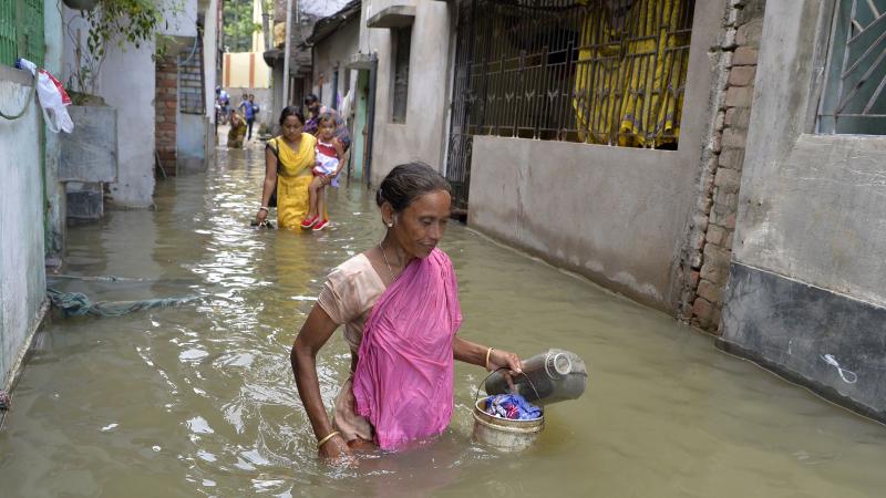 Residents walk through floodwaters in Malda, West Bengal, India, on Thursday. The death toll from floods sweeping South Asia has climbed above 1,000, according to news services tracking official tallies. Residents walk through floodwaters in Malda, West Bengal, India, on Thursday. The death toll from floods sweeping South Asia has climbed above 1,000, according to news services tracking official tallies.