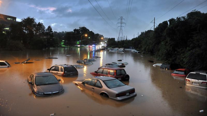 Scenes after heavy rainfall flooded a commuter parking lot in Reston, VA with some cars completely submerged. Scenes after heavy rainfall flooded a commuter parking lot in Reston, VA with some cars completely submerged.
