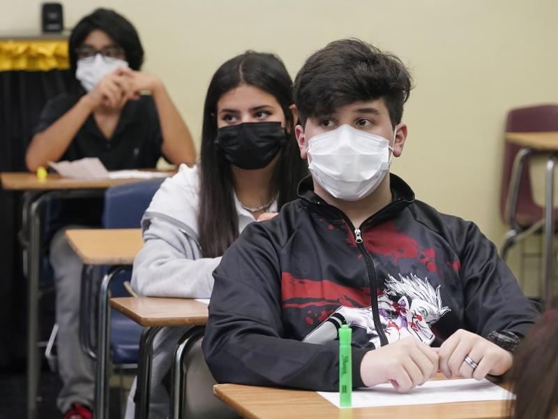 Students sit in an algebra class at Barbara Coleman Senior High School on the first day of school on Monday in Miami Lakes, Fla. Miami-Dade County public schools require students to wear a mask to prevent the spread of COVID-19. Students sit in an algebra class at Barbara Coleman Senior High School on the first day of school on Monday in Miami Lakes, Fla. Miami-Dade County public schools require students to wear a mask to prevent the spread of COVID-19.