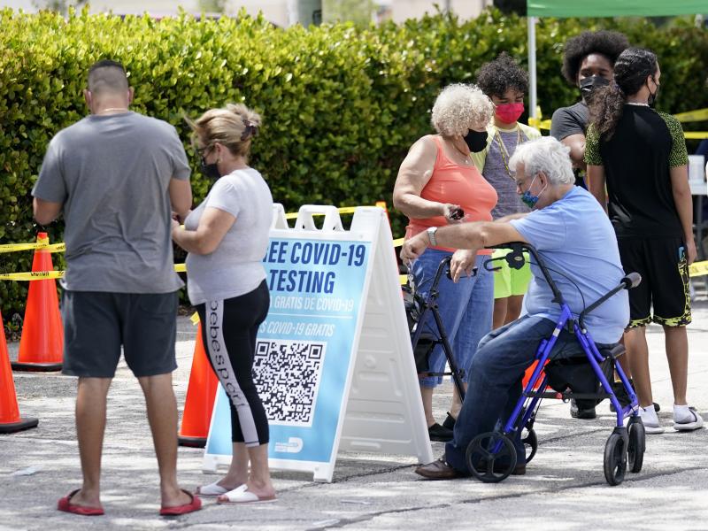 People wait in line at a Miami-Dade County COVID-19 testing site, Monday, July 26, 2021, in Hialeah, Fla. Florida accounted for a fifth of the nation's new infections last week, more than any other state, according to the CDC. People wait in line at a Miami-Dade County COVID-19 testing site, Monday, July 26, 2021, in Hialeah, Fla. Florida accounted for a fifth of the nation's new infections last week, more than any other state, according to the CDC.