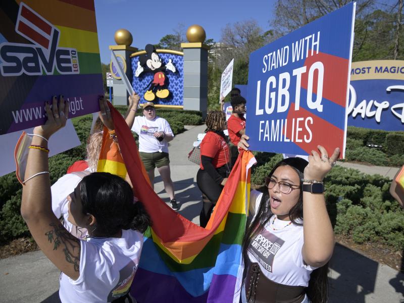 LGBTQ advocates march at a rally at Walt Disney World in Orlando, Fla., to urge the company to publicly oppose what they call the "Don't Say Gay" that aims to limit instruction of gender identity and sexual orientation in schools. LGBTQ advocates march at a rally at Walt Disney World in Orlando, Fla., to urge the company to publicly oppose what they call the "Don't Say Gay" that aims to limit instruction of gender identity and sexual orientation in schools.