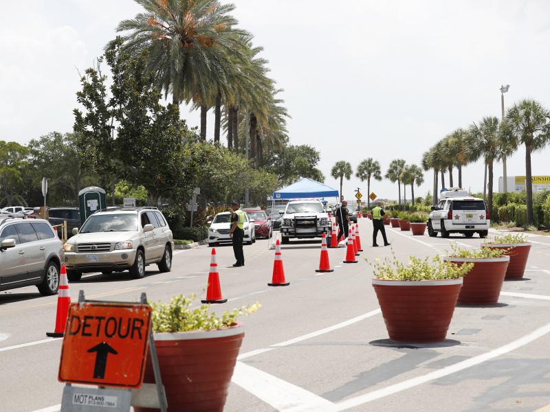Cars line up for drive-through coronavirus testing in St. Petersburg, Florida. The state reported a record-breaking 15,299 new cases on Sunday. Cars line up for drive-through coronavirus testing in St. Petersburg, Florida. The state reported a record-breaking 15,299 new cases on Sunday.