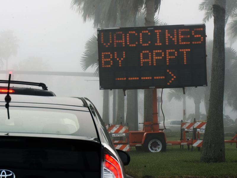 A sign directs drivers to a COVID-19 vaccination site at the Orange County Convention Center in Orlando, Fla. Health officials in Orange County said on Thursday that two women were caught dressing up as "grannies" in an effort to cut the vaccine line. A sign directs drivers to a COVID-19 vaccination site at the Orange County Convention Center in Orlando, Fla. Health officials in Orange County said on Thursday that two women were caught dressing up as "grannies" in an effort to cut the vaccine line.