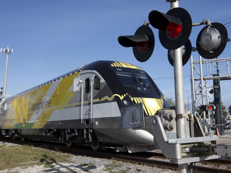 A Brightline train approaches a railroad crossing on Jan. 18, 2018, in Fort Lauderdale, Fla. In its first two years, more than 40 people have been killed by Brightline trains on tracks and at rail crossings. A Brightline train approaches a railroad crossing on Jan. 18, 2018, in Fort Lauderdale, Fla. In its first two years, more than 40 people have been killed by Brightline trains on tracks and at rail crossings.