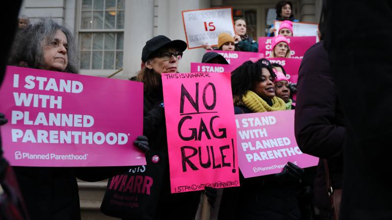 Abortion-rights activists gathered for a news conference in New York City Monday to protest the Trump administration's proposed restrictions on family planning providers. The rule would force any medical provider receiving federal assistance to refuse to Abortion-rights activists gathered for a news conference in New York City Monday to protest the Trump administration's proposed restrictions on family planning providers. The rule would force any medical provider receiving federal assistance to refuse to