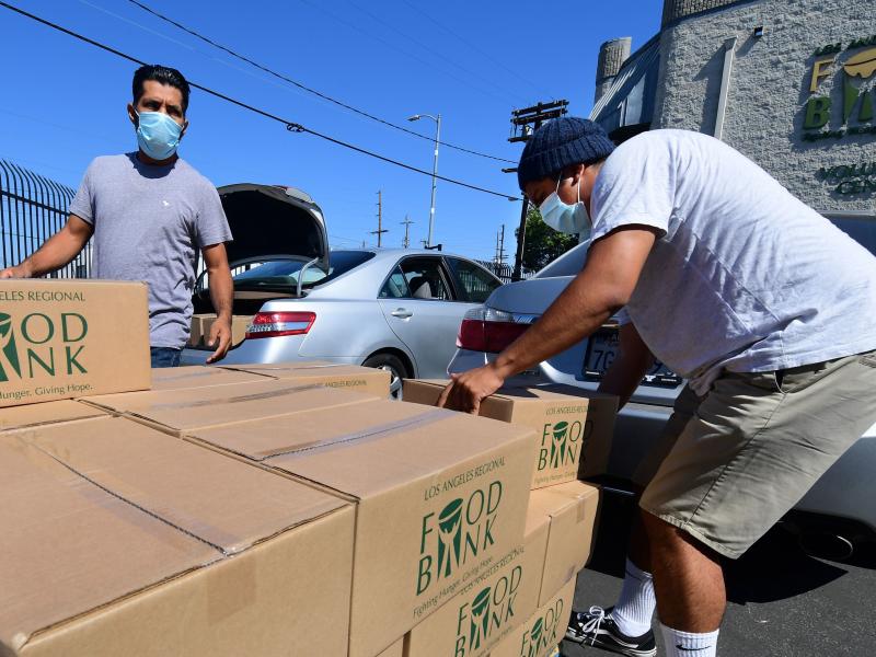 People load their vehicles with boxes of food at a Los Angeles Regional Food Bank earlier this month in Los Angeles. Food banks across the United States are seeing numbers and people they have never seen before amid unprecedented unemployment from the COV People load their vehicles with boxes of food at a Los Angeles Regional Food Bank earlier this month in Los Angeles. Food banks across the United States are seeing numbers and people they have never seen before amid unprecedented unemployment from the COV