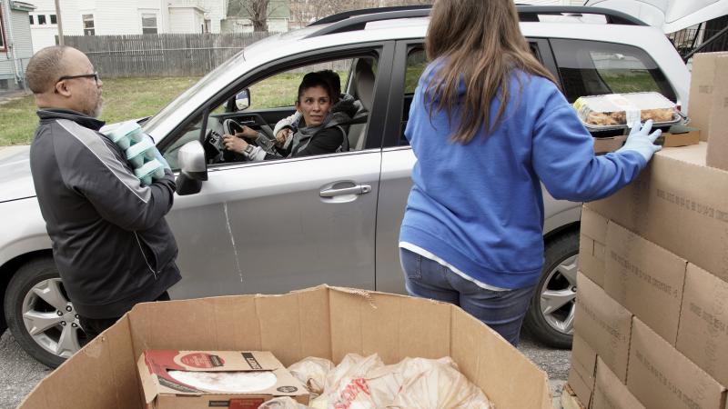 Together Inc. food bank workers distribute food at a drive-through location in Omaha, Neb., last week. Disruptions in the agricultural supply chain caused by the coronavirus pandemic are making it difficult for food banks. Together Inc. food bank workers distribute food at a drive-through location in Omaha, Neb., last week. Disruptions in the agricultural supply chain caused by the coronavirus pandemic are making it difficult for food banks.