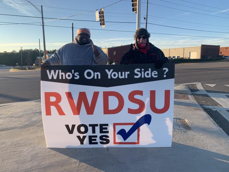 Representatives from the Retail, Wholesale and Department Store Union hold a pro-unionization sign outside Amazon's warehouse in Bessemer, Ala. Representatives from the Retail, Wholesale and Department Store Union hold a pro-unionization sign outside Amazon's warehouse in Bessemer, Ala.