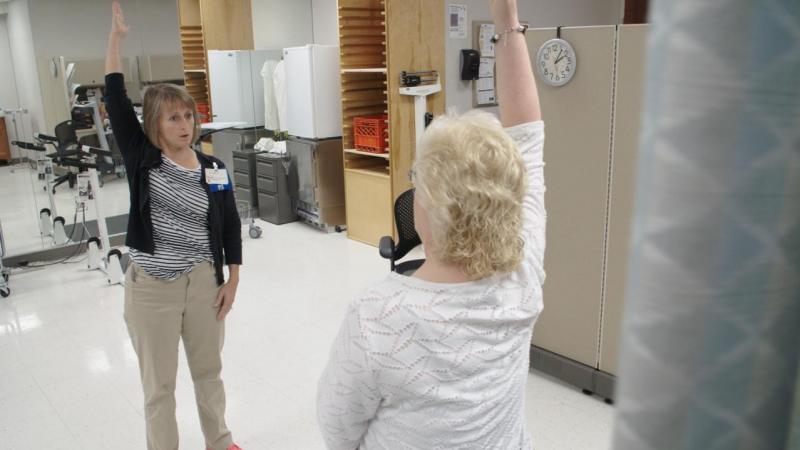 Physical therapist Ingrid Peele coaches Kim Brown through strengthening exercises to help her with her chronic pain, at the OSF Central Illinois Pain Center in Peoria. Physical therapist Ingrid Peele coaches Kim Brown through strengthening exercises to help her with her chronic pain, at the OSF Central Illinois Pain Center in Peoria.