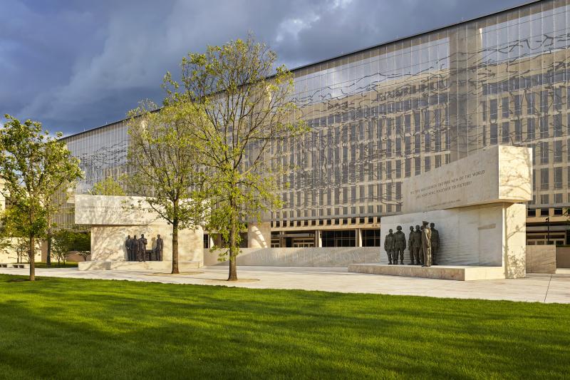 The Dwight D. Eisenhower Memorial in Washington, D.C., will be dedicated on Thursday. A stainless steel, woven "tapestry" made by artist Tomas Osinski stands behind the statues and depicts the cliffs at Normandy. The Dwight D. Eisenhower Memorial in Washington, D.C., will be dedicated on Thursday. A stainless steel, woven "tapestry" made by artist Tomas Osinski stands behind the statues and depicts the cliffs at Normandy.
