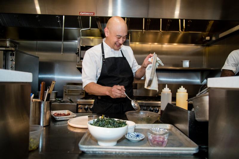Tim Ma prepares a duck confit salad at his restaurant, Kyirisan, in Washington, D.C. Ma says being mindful about reducing food waste is an integral part of his philosophy in the kitchen — not just for environmental reasons but also for profitability. Tim Ma prepares a duck confit salad at his restaurant, Kyirisan, in Washington, D.C. Ma says being mindful about reducing food waste is an integral part of his philosophy in the kitchen — not just for environmental reasons but also for profitability.
