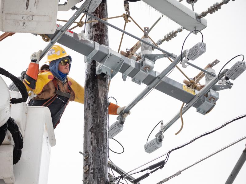 A worker repairs a power line in Austin, Texas, on Thursday. Although power was slowly being restored to much of the state, weather-related water issues persist. A worker repairs a power line in Austin, Texas, on Thursday. Although power was slowly being restored to much of the state, weather-related water issues persist.