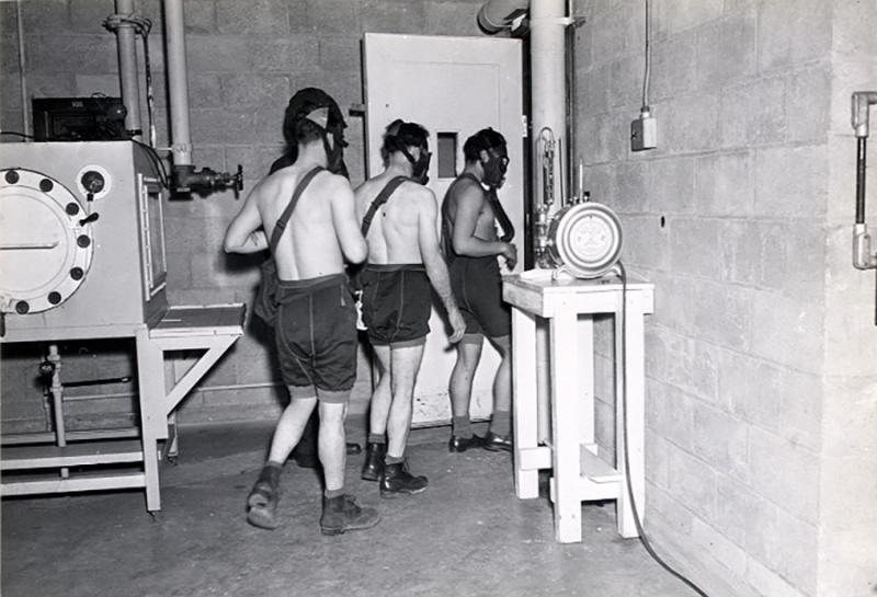 In this 1945 image, test subjects enter a gas chamber for a U.S. military experiment that will expose them to mustard gas. In this 1945 image, test subjects enter a gas chamber for a U.S. military experiment that will expose them to mustard gas.