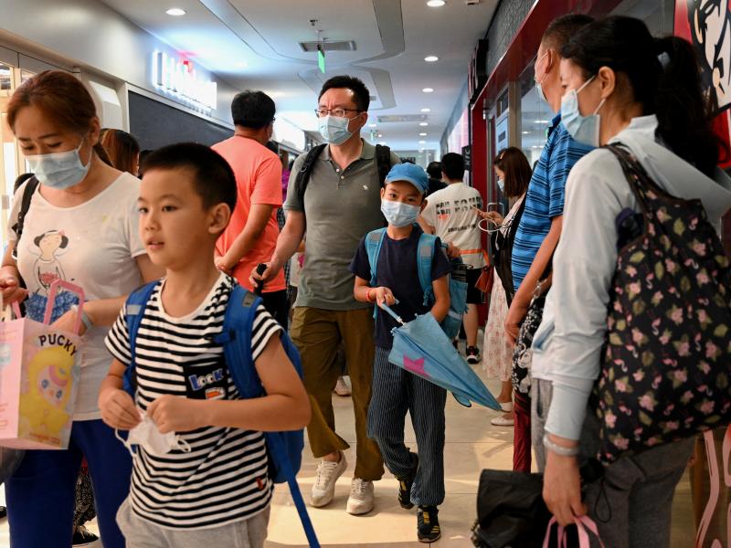 Students and parents walk after a private after-school session in Beijing's Haidan district, where competition is cutthroat for a spot in top schools. Students and parents walk after a private after-school session in Beijing's Haidan district, where competition is cutthroat for a spot in top schools.
