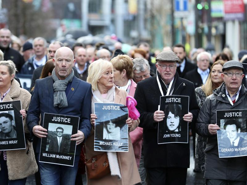Families of victims of Bloody Sunday, in which 13 unarmed protesters were killed in 1972, marched before the prosecutor's announced charges against a former British paratrooper. Families of victims of Bloody Sunday, in which 13 unarmed protesters were killed in 1972, marched before the prosecutor's announced charges against a former British paratrooper.