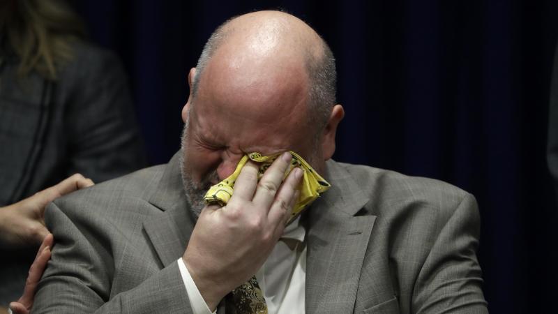 Former priest James Faluszczak, who says he was molested as a teenager by a priest, reacts as Pennsylvania Attorney General Josh Shapiro speaks during a news conference at the Pennsylvania Capitol in Harrisburg on Tuesday. Former priest James Faluszczak, who says he was molested as a teenager by a priest, reacts as Pennsylvania Attorney General Josh Shapiro speaks during a news conference at the Pennsylvania Capitol in Harrisburg on Tuesday.