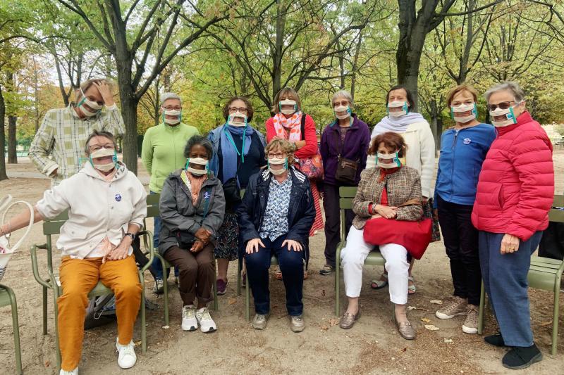 Suzy Margueron (seated, center) who advocates for people with hearing loss, likes to gather with friends in Paris' Luxembourg Gardens. All have transparent masks, but say it's others who should be wearing them too. Suzy Margueron (seated, center) who advocates for people with hearing loss, likes to gather with friends in Paris' Luxembourg Gardens. All have transparent masks, but say it's others who should be wearing them too.