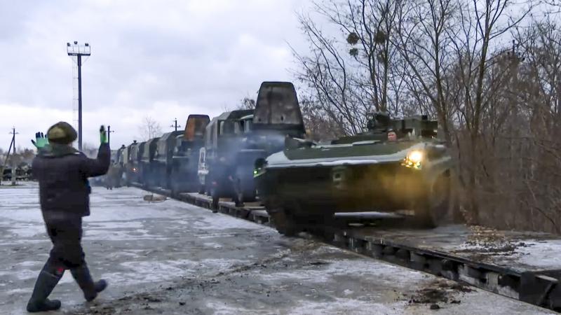 In this photo taken from video provided by the Russian Defense Ministry Press Service, a Russian armored vehicle drives off a railway platform after arrival in Belarus, Jan. 19, 2021. An estimated 100,000 Russian troops near Ukraine has fueled Western fea In this photo taken from video provided by the Russian Defense Ministry Press Service, a Russian armored vehicle drives off a railway platform after arrival in Belarus, Jan. 19, 2021. An estimated 100,000 Russian troops near Ukraine has fueled Western fea