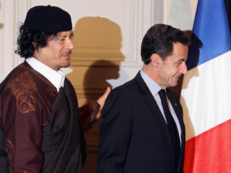 French President Nicolas Sarkozy (right) and Libyan leader Moammar Gadhafi leave the Elysee Palace after the signature of 10 billion euros of trade contracts between the two countries, in December 2007 in Paris. French President Nicolas Sarkozy (right) and Libyan leader Moammar Gadhafi leave the Elysee Palace after the signature of 10 billion euros of trade contracts between the two countries, in December 2007 in Paris.