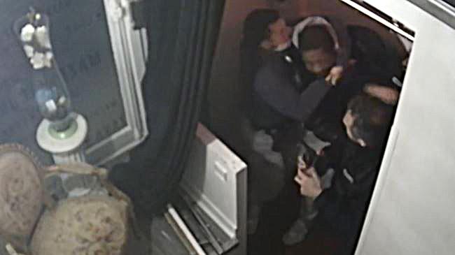 This video grab taken on Thursday from an AFP video shows CCTV camera footage, widely distributed on social networks, shows producer Michel Zecler being beaten up by police officers at the entrance of a music studio in the 17th arrondissement of Paris on This video grab taken on Thursday from an AFP video shows CCTV camera footage, widely distributed on social networks, shows producer Michel Zecler being beaten up by police officers at the entrance of a music studio in the 17th arrondissement of Paris on