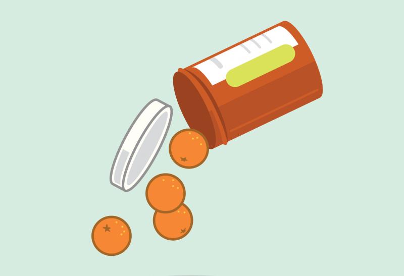 Miniature oranges spill out of a pill bottle. Miniature oranges spill out of a pill bottle.