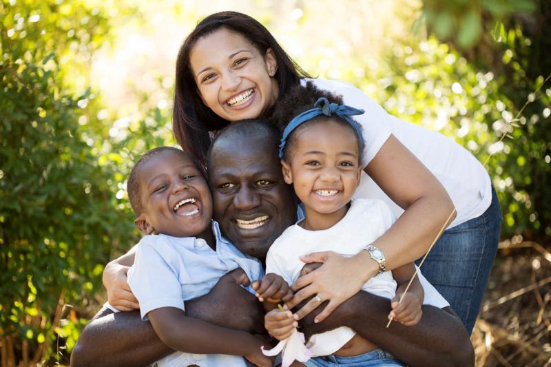 Carl Manlan, his wife, Lelani, and their two kids, Liam and Claire. Carl Manlan, his wife, Lelani, and their two kids, Liam and Claire.