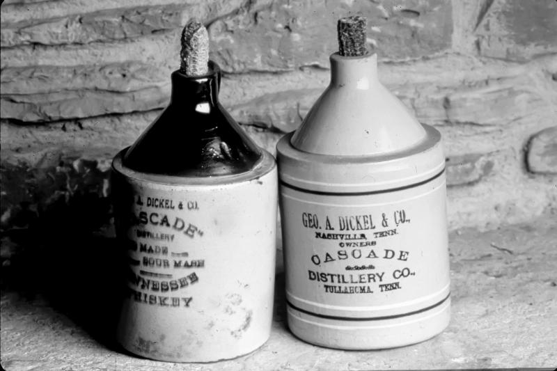 Before distilleries used glass bottles, many of them offered liquor stores branded ceramic jugs that could be filled and sold to customers. This pair of George Dickel jugs was used around 1900. From The Art of American Whiskey by Noah Rothbaum. Before distilleries used glass bottles, many of them offered liquor stores branded ceramic jugs that could be filled and sold to customers. This pair of George Dickel jugs was used around 1900. From The Art of American Whiskey by Noah Rothbaum.