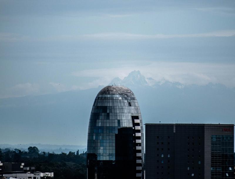 A photo taken last month by Nairobi resident Osman Siddiqi shows One Africa Place, a bullet-shaped glass high-rise in Nairobi, framed by the jagged, snowcapped peaks of Mount Kenya, which many residents said they have never seen from the capital city. A photo taken last month by Nairobi resident Osman Siddiqi shows One Africa Place, a bullet-shaped glass high-rise in Nairobi, framed by the jagged, snowcapped peaks of Mount Kenya, which many residents said they have never seen from the capital city.
