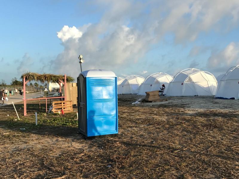 Tents and a portable toilet set up for attendees for the Fyre Festival on Friday, in the Bahamas' Exuma islands. Tents and a portable toilet set up for attendees for the Fyre Festival on Friday, in the Bahamas' Exuma islands.