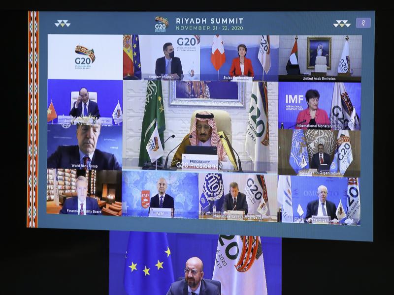 European Council President Charles Michel, on screen bottom, participates in a virtual G-20 meeting, hosted by Saudi Arabia, at the European Council building in Brussels on Saturday. European Council President Charles Michel, on screen bottom, participates in a virtual G-20 meeting, hosted by Saudi Arabia, at the European Council building in Brussels on Saturday.