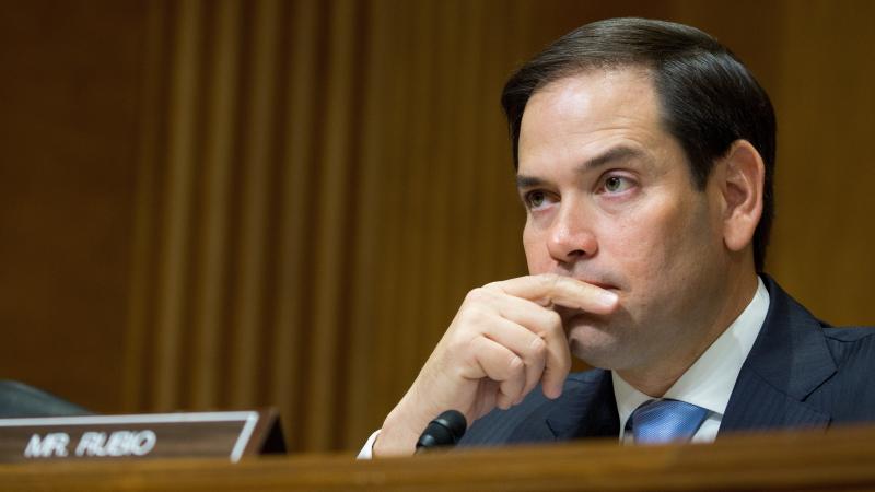 Florida Republican Sen. Marco Rubio, shown in July, had threatened a "no" vote on the bill because he wanted a more generous child tax credit for working families. He said Friday he will vote for the measure. Florida Republican Sen. Marco Rubio, shown in July, had threatened a "no" vote on the bill because he wanted a more generous child tax credit for working families. He said Friday he will vote for the measure.