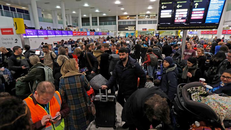 Passengers wait Thursday after Gatwick Airport was forced to shut down operations because of drones flown illegally over its airfield. Passengers wait Thursday after Gatwick Airport was forced to shut down operations because of drones flown illegally over its airfield.