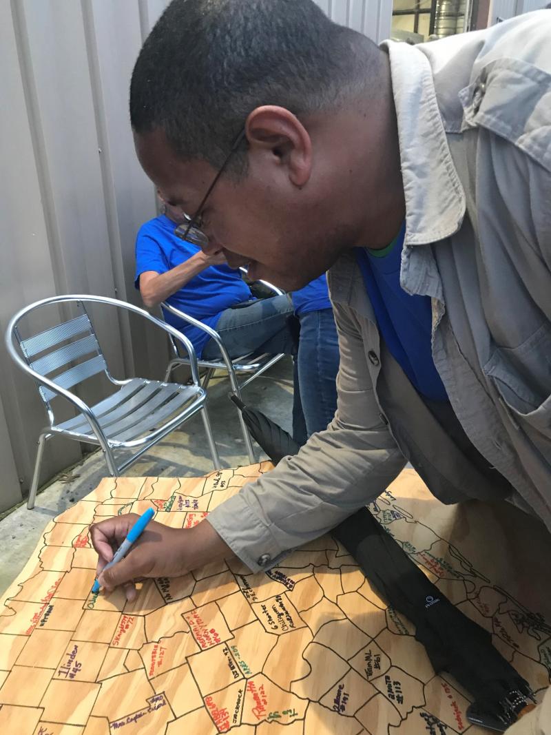 Marcellus Cadd signing his name in Round Rock, Texas, after finding a cache in all 254 counties in the state. Marcellus Cadd signing his name in Round Rock, Texas, after finding a cache in all 254 counties in the state.
