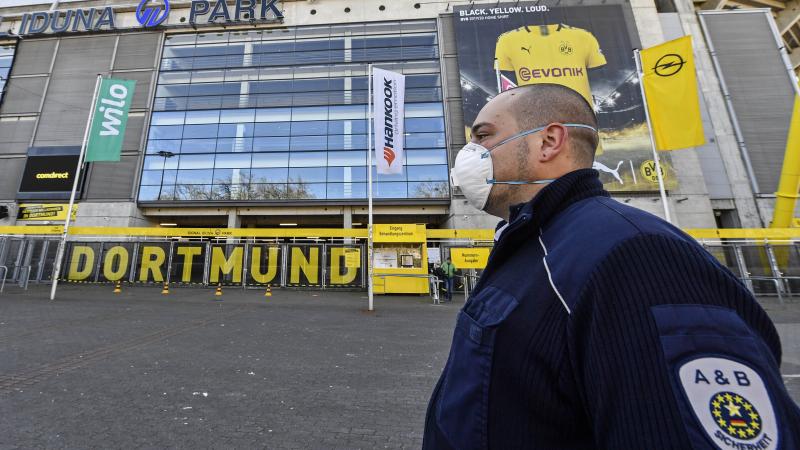 Security with face masks stand in front of the Signal Iduna Park, where a temporary coronavirus treatment center opened in Dortmund, Germany, Saturday. Germany has the fourth-most COVID-19 cases in the world and demand for medical supplies has skyrocketed Security with face masks stand in front of the Signal Iduna Park, where a temporary coronavirus treatment center opened in Dortmund, Germany, Saturday. Germany has the fourth-most COVID-19 cases in the world and demand for medical supplies has skyrocketed