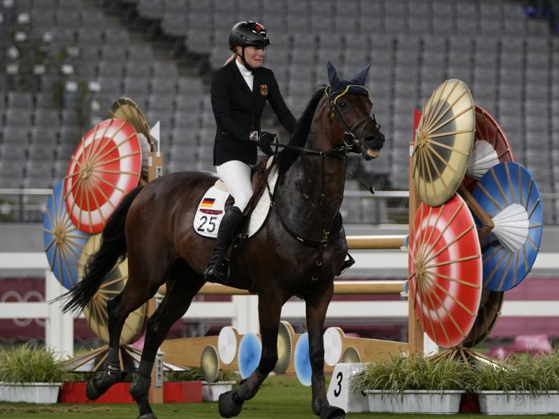 Annika Schleu of Germany cries after failing to control her horse while competing in the equestrian portion of the women's modern pentathlon at the 2020 Summer Olympics on Friday. Annika Schleu of Germany cries after failing to control her horse while competing in the equestrian portion of the women's modern pentathlon at the 2020 Summer Olympics on Friday.