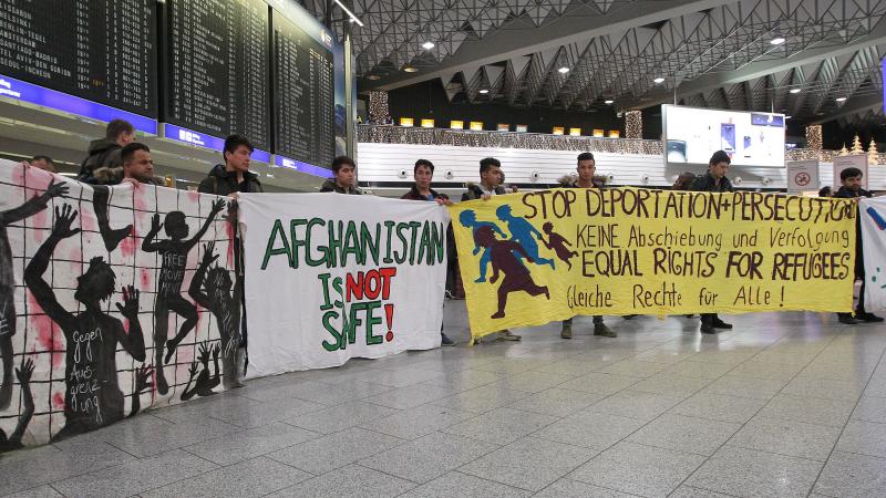Demonstrators protest against the deportation of refugees back to Afghanistan at the Frankfurt, Germany, airport Wednesday night. Demonstrators protest against the deportation of refugees back to Afghanistan at the Frankfurt, Germany, airport Wednesday night.