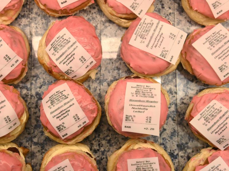 Doughnuts with a receipt made of fondant were on display last week at a bakery in Moosinning, Germany. These Kassenbon Krapfen — receipt doughnuts — are a reaction to Germany's new receipt law. Doughnuts with a receipt made of fondant were on display last week at a bakery in Moosinning, Germany. These Kassenbon Krapfen — receipt doughnuts — are a reaction to Germany's new receipt law.