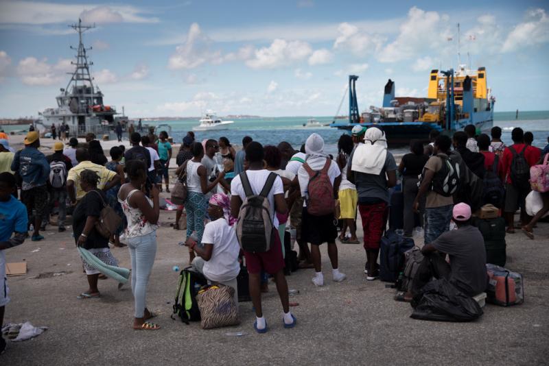 Several hundred Haitians and Bahamians wait at the port of Marsh Harbour in hopes of boarding a boat to Nassau on Friday. Several hundred Haitians and Bahamians wait at the port of Marsh Harbour in hopes of boarding a boat to Nassau on Friday.