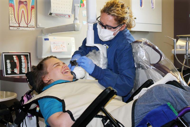 Hygienist Beth Rowan cleans the teeth of Lindsay Klecker, 31, who has cerebral palsy and a seizure disorder. Rowan works at the Marshfield Clinic in Chippewa Falls, Wis. Hygienist Beth Rowan cleans the teeth of Lindsay Klecker, 31, who has cerebral palsy and a seizure disorder. Rowan works at the Marshfield Clinic in Chippewa Falls, Wis.
