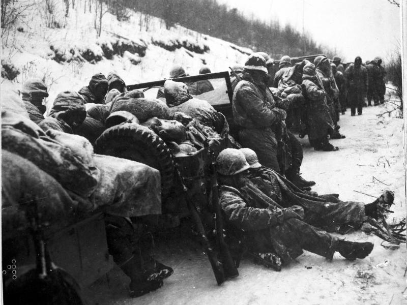 Marines of the 5th and 7th regiments who hurled back a surprise onslaught by three Chinese communist divisions wait to withdraw from the Chosin Reservoir area circa December 1950. Marines of the 5th and 7th regiments who hurled back a surprise onslaught by three Chinese communist divisions wait to withdraw from the Chosin Reservoir area circa December 1950.