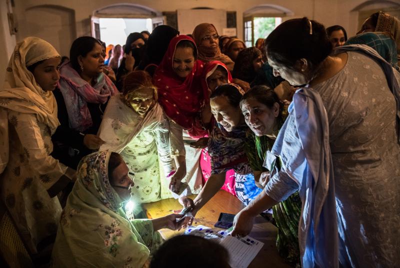 Pakistani women jostle to receive their ballot papers prior to casting their ballot at a polling station on May 11, 2013 in Lahore. A study in The Lancet provides evidence that free and fair elections are associated with a lower burden of chronic diseases Pakistani women jostle to receive their ballot papers prior to casting their ballot at a polling station on May 11, 2013 in Lahore. A study in The Lancet provides evidence that free and fair elections are associated with a lower burden of chronic diseases