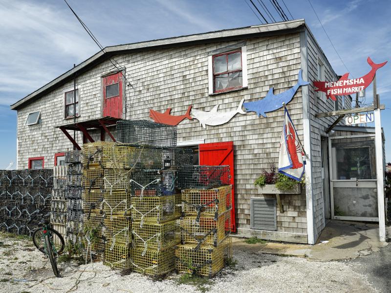 The steel used to build lobster traps like these, stacked up outside a fish market on Martha's Vineyard, is getting pricier, thanks to new tariffs. The steel used to build lobster traps like these, stacked up outside a fish market on Martha's Vineyard, is getting pricier, thanks to new tariffs.