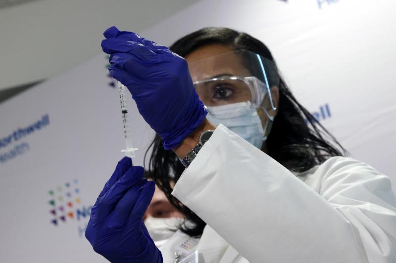 A medical worker at South Shore University Hospital gets ready to administer the newly available Johnson & Johnson COVID-19 vaccine in Bay Shore, N.Y., Wednesday. Clinical research found it to be 85% effective in preventing severe disease four weeks after A medical worker at South Shore University Hospital gets ready to administer the newly available Johnson & Johnson COVID-19 vaccine in Bay Shore, N.Y., Wednesday. Clinical research found it to be 85% effective in preventing severe disease four weeks after