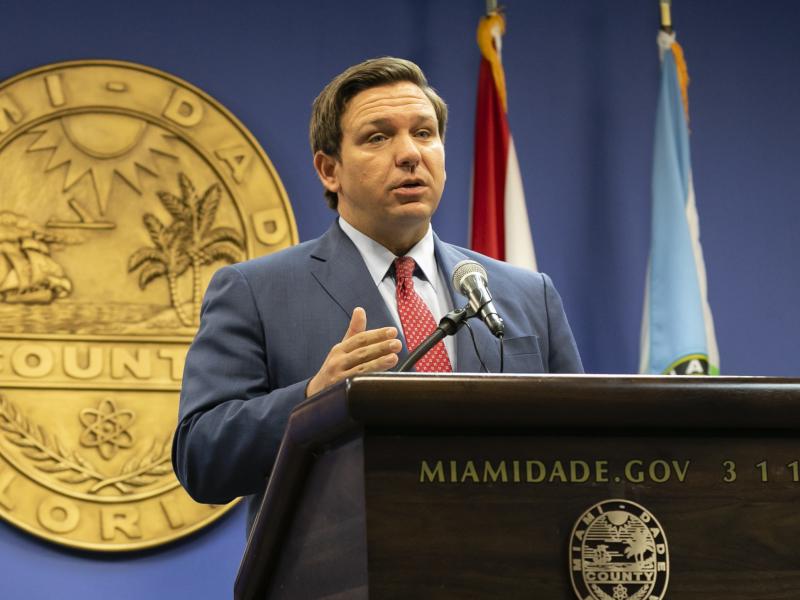 Florida Gov. Ron DeSantis, here in June, said this week that the state's troubled unemployment portal was designed to discourage people applying for benefits. The portal launched in 2013 under then-Gov. Rick Scott, now a U.S. senator. Florida Gov. Ron DeSantis, here in June, said this week that the state's troubled unemployment portal was designed to discourage people applying for benefits. The portal launched in 2013 under then-Gov. Rick Scott, now a U.S. senator.