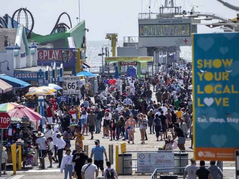 The Santa Monica Pier welcomed outdoor visitors on Monday as Los Angeles County entered the less-restrictive orange tier. The following day, California Gov. Gavin Newsom announced a target statewide reopening date of June 15, provided certain public healt The Santa Monica Pier welcomed outdoor visitors on Monday as Los Angeles County entered the less-restrictive orange tier. The following day, California Gov. Gavin Newsom announced a target statewide reopening date of June 15, provided certain public healt