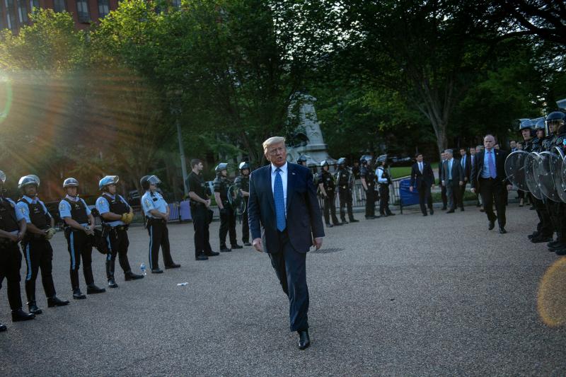 US President Trump leaves the White House on foot to go to St John's Episcopal church across Lafayette Park in Washington, D.C. Monday. US President Trump leaves the White House on foot to go to St John's Episcopal church across Lafayette Park in Washington, D.C. Monday.