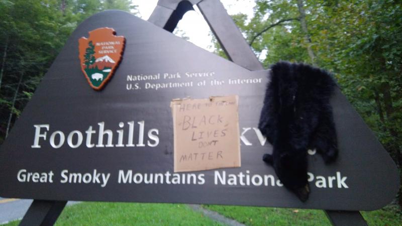 An entrance to Great Smoky Mountains National Park in Tennessee was vandalized last weekend with the skin of a black bear and a sign that read "Here To The Lake Black Lives Don't Matter." An entrance to Great Smoky Mountains National Park in Tennessee was vandalized last weekend with the skin of a black bear and a sign that read "Here To The Lake Black Lives Don't Matter."