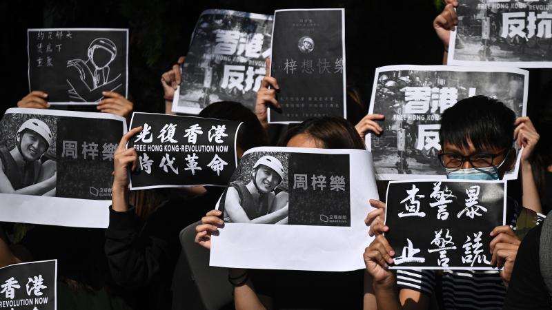 Students of the Hong Kong University of Science and Technology take part in a march toward the school president's lodge Friday, following the death of a student injured during clashes between police and protesters a few days ago. Students of the Hong Kong University of Science and Technology take part in a march toward the school president's lodge Friday, following the death of a student injured during clashes between police and protesters a few days ago.
